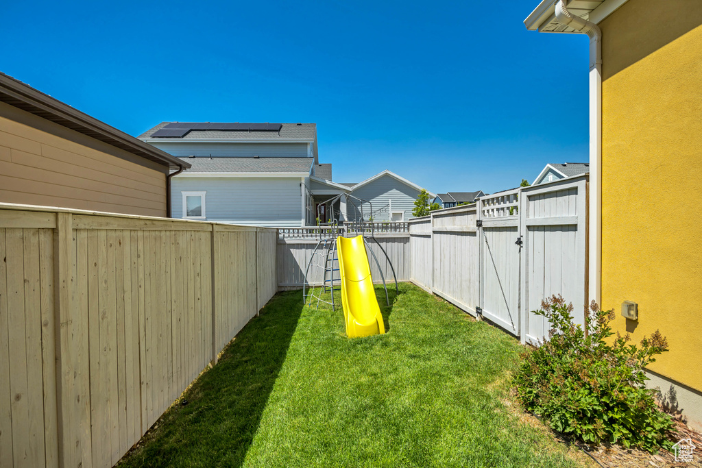 View of yard with a playground and a residential view