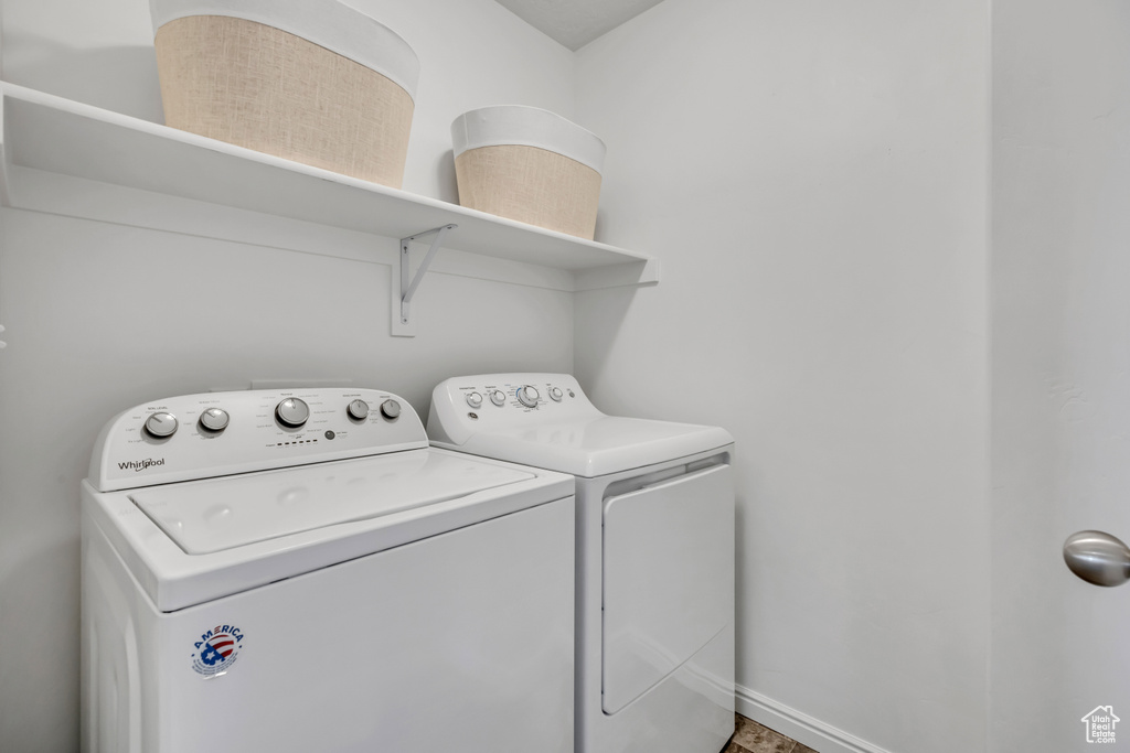 Laundry room with washing machine and dryer