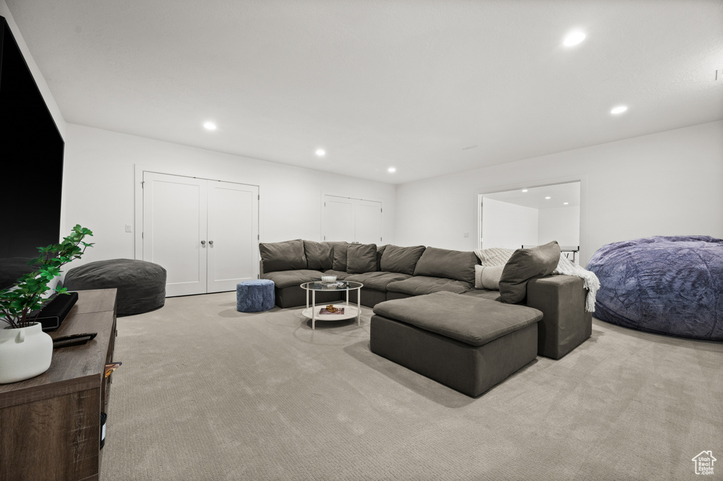 Living room featuring light carpet and recessed lighting