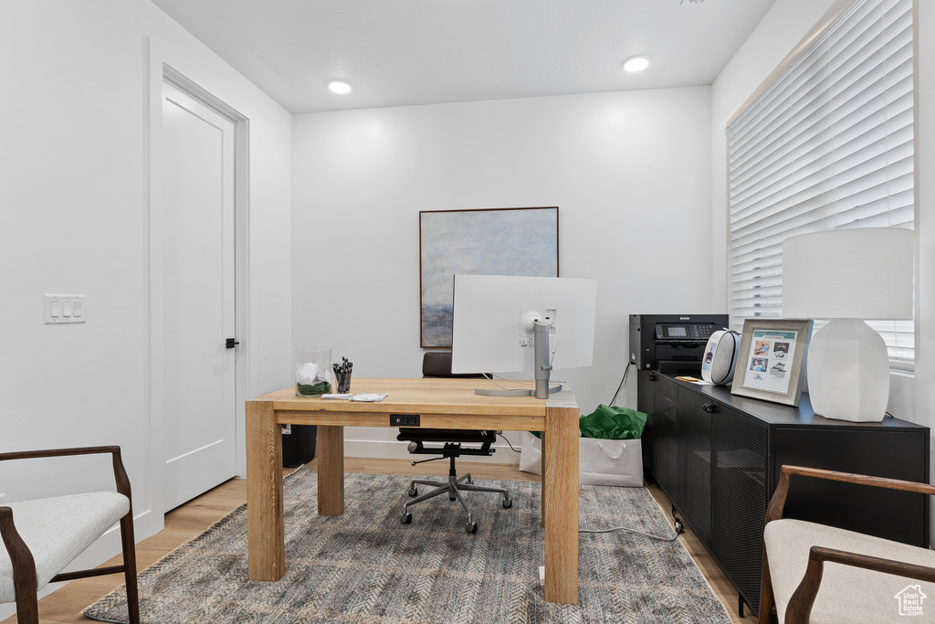 Office featuring wood finished floors and recessed lighting