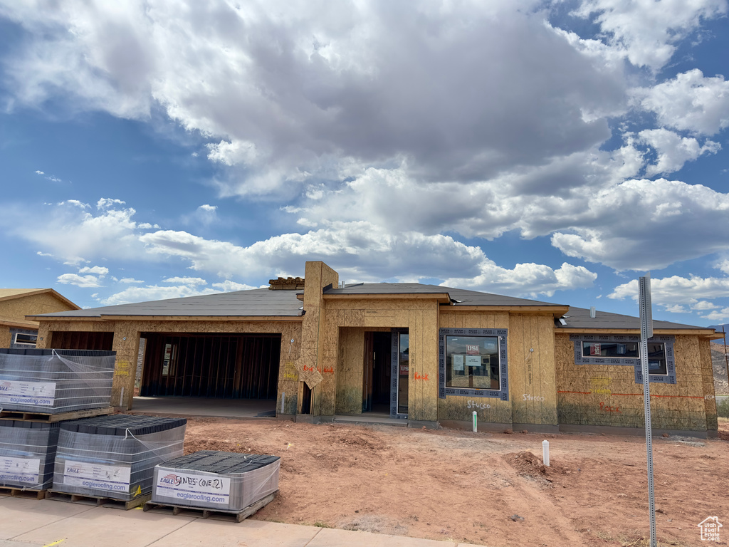 Property in mid-construction with an attached garage