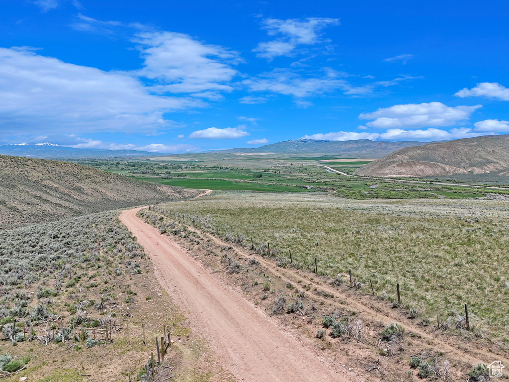 View of mountain background featuring rural landscape