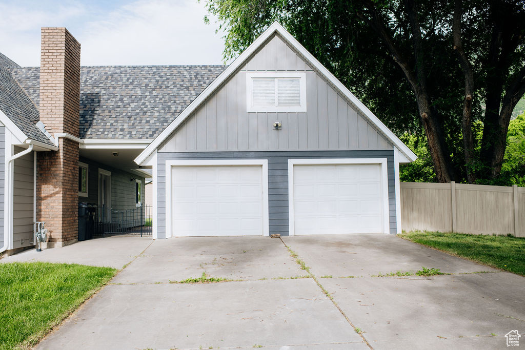 Garage featuring driveway