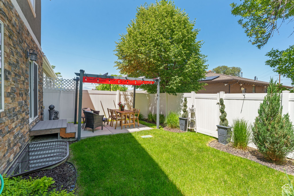 View of yard with a patio area
