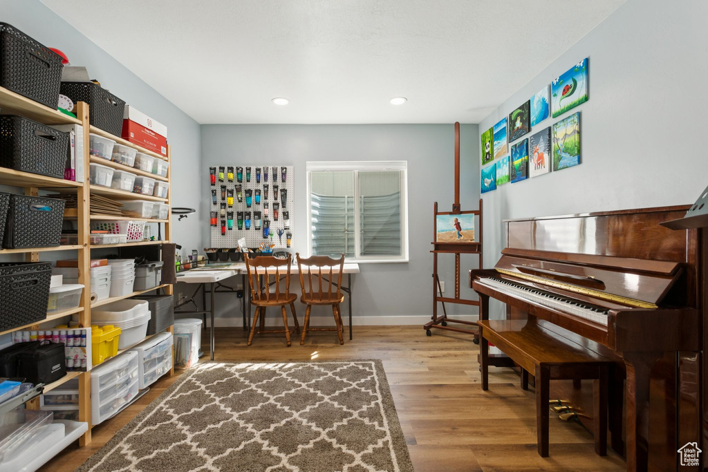 Office area featuring wood finished floors, baseboards, and recessed lighting
