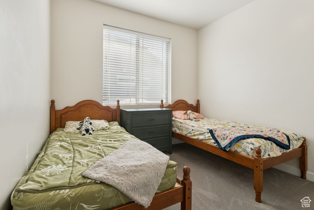 Carpeted bedroom with baseboards