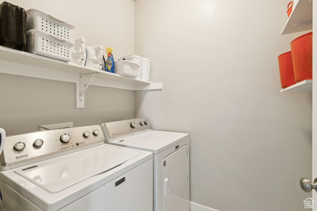 Laundry room featuring washer and clothes dryer