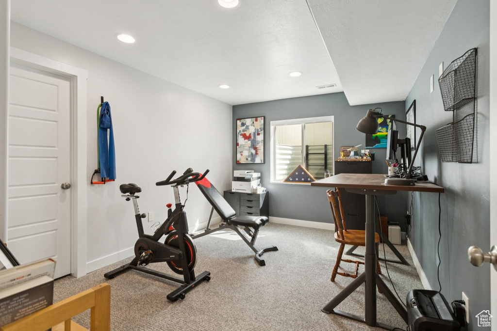 Workout room featuring carpet, baseboards, and recessed lighting