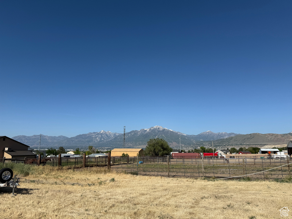 View of mountain backdrop featuring rural landscape
