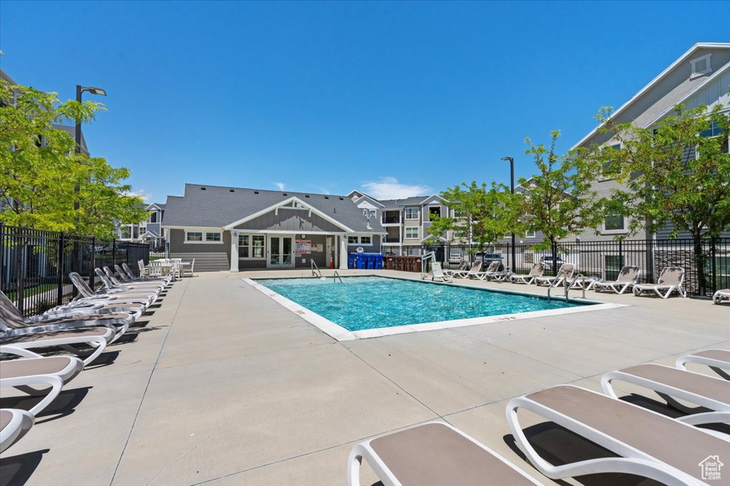 Community pool featuring a patio area