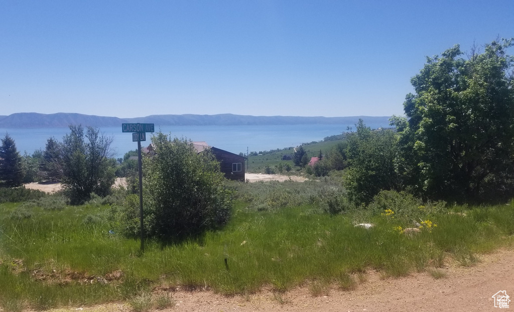 View of mountain backdrop featuring a nearby body of water