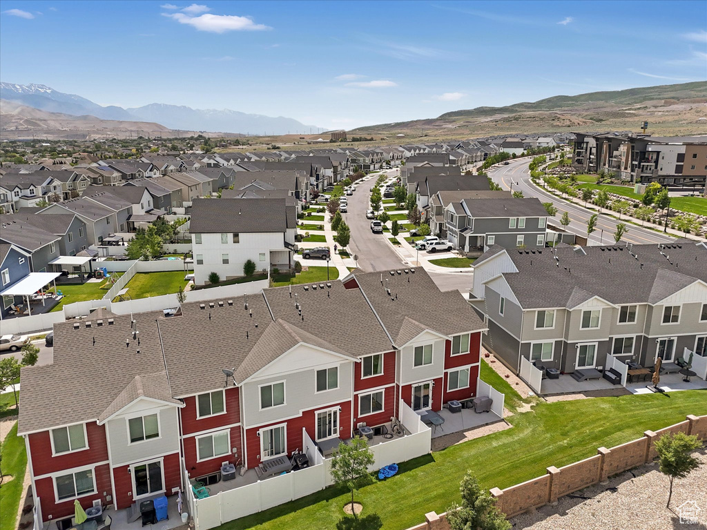 Aerial view of residential area featuring mountains