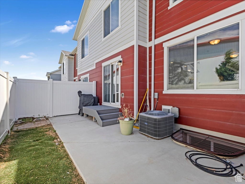 View of patio featuring cooling unit