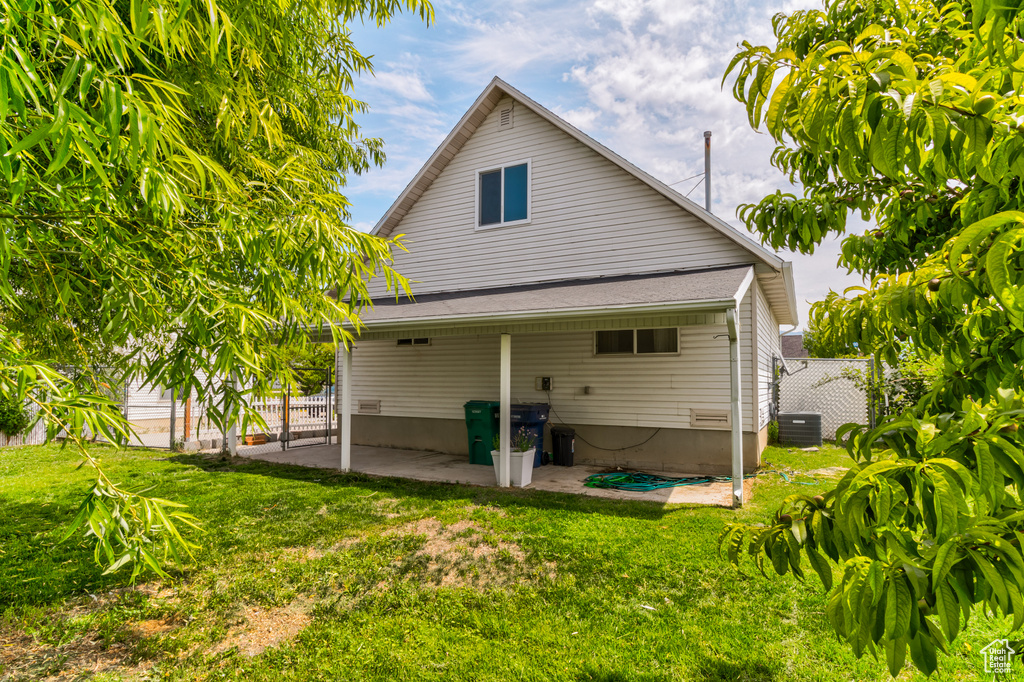 Rear view of property with a patio area and cooling unit