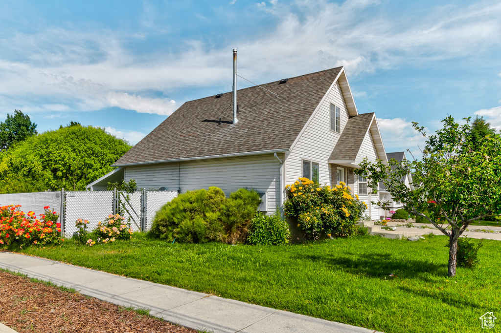 View of home\'s exterior with roof with shingles