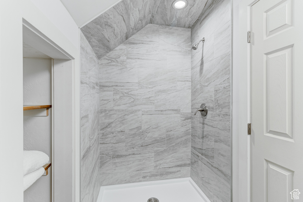 Full bath featuring a shower stall