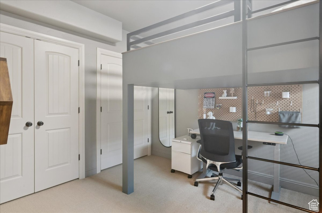Home office with light carpet