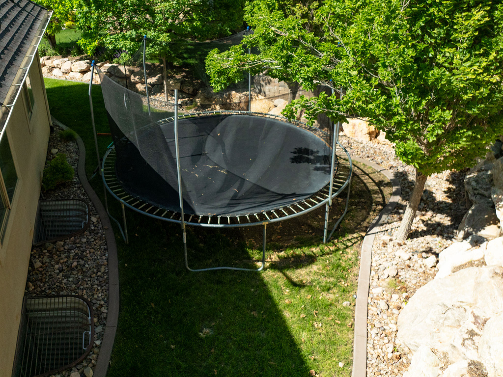 View of yard with a trampoline