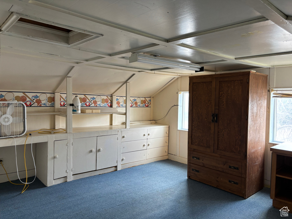 Unfurnished bedroom with multiple windows and carpet floors