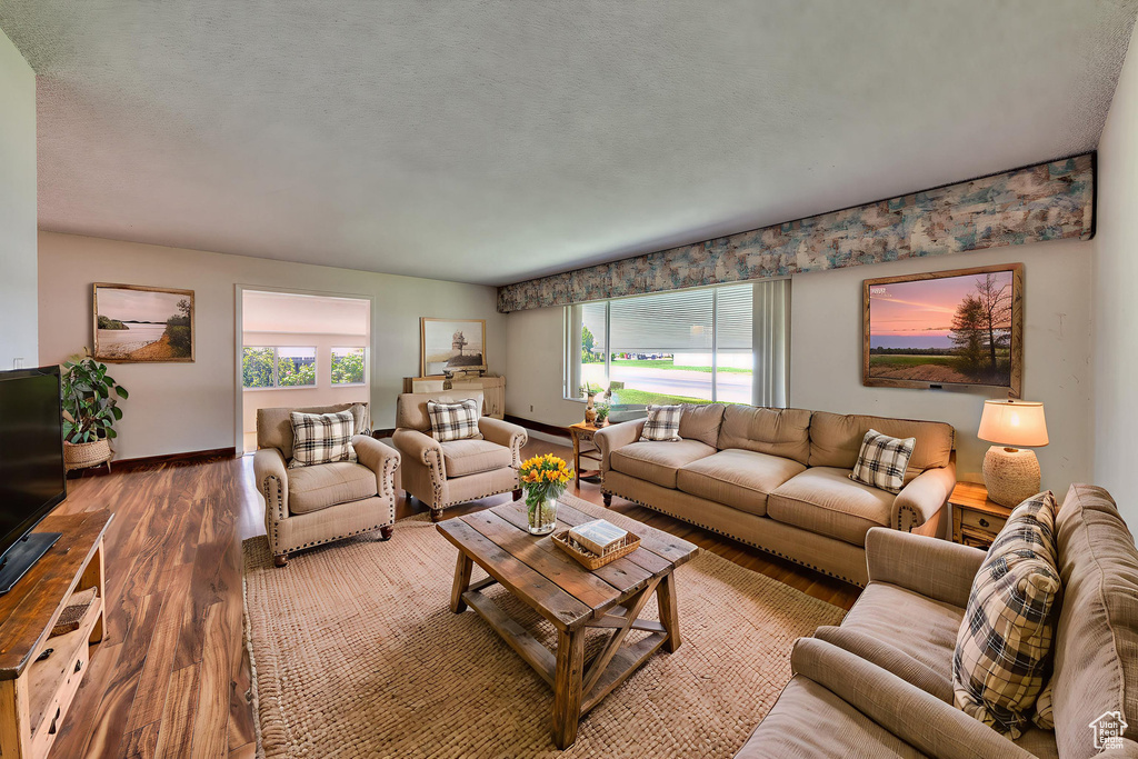 Living room featuring wood finished floors and baseboards