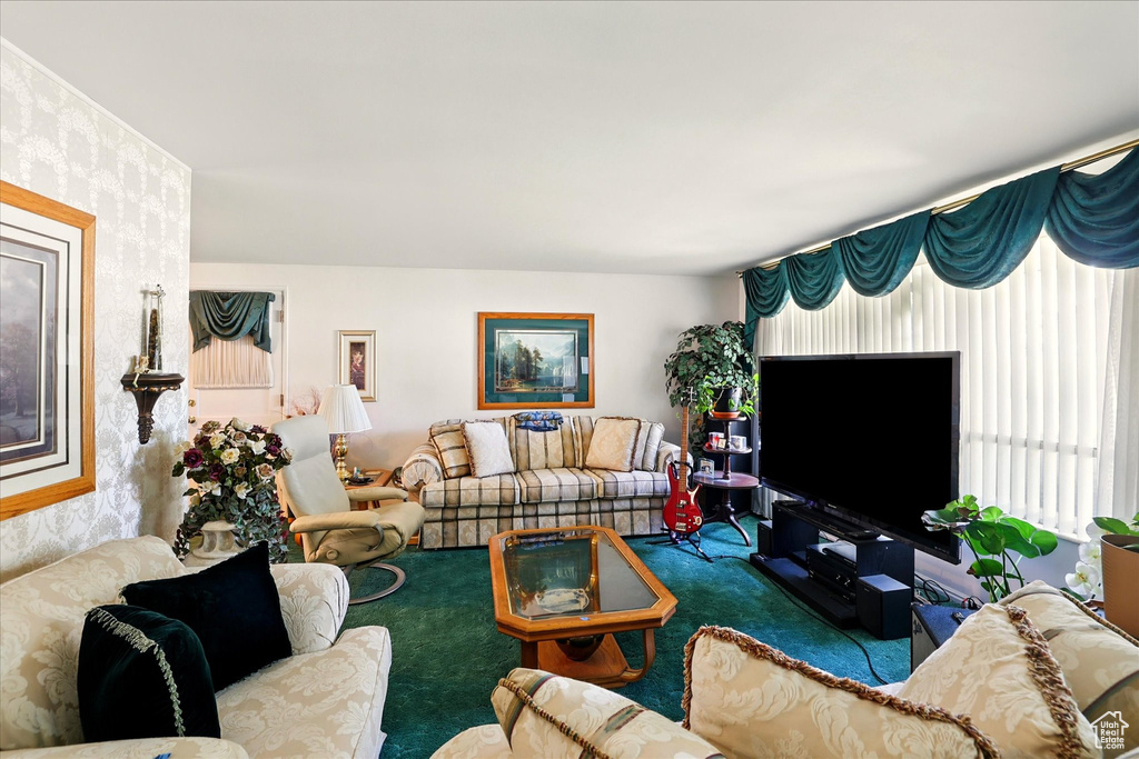Carpeted living room featuring wallpapered walls