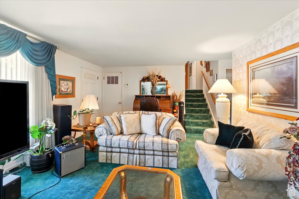 Living room featuring stairway and carpet floors