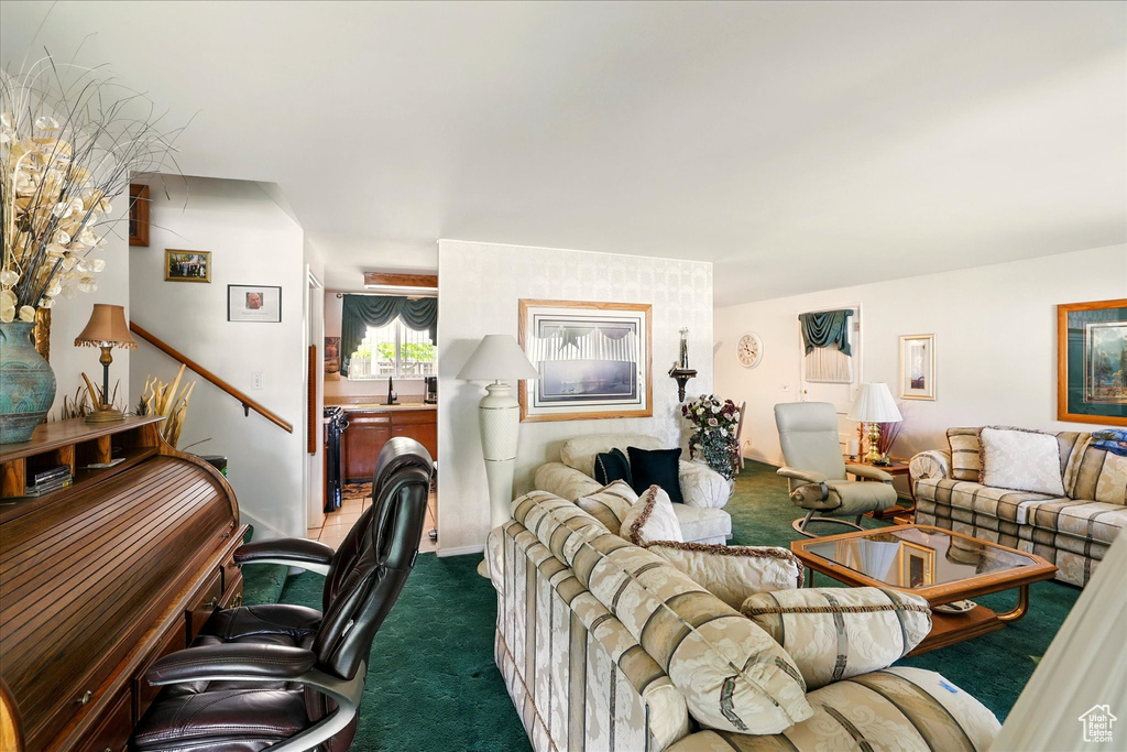 Living area featuring dark colored carpet