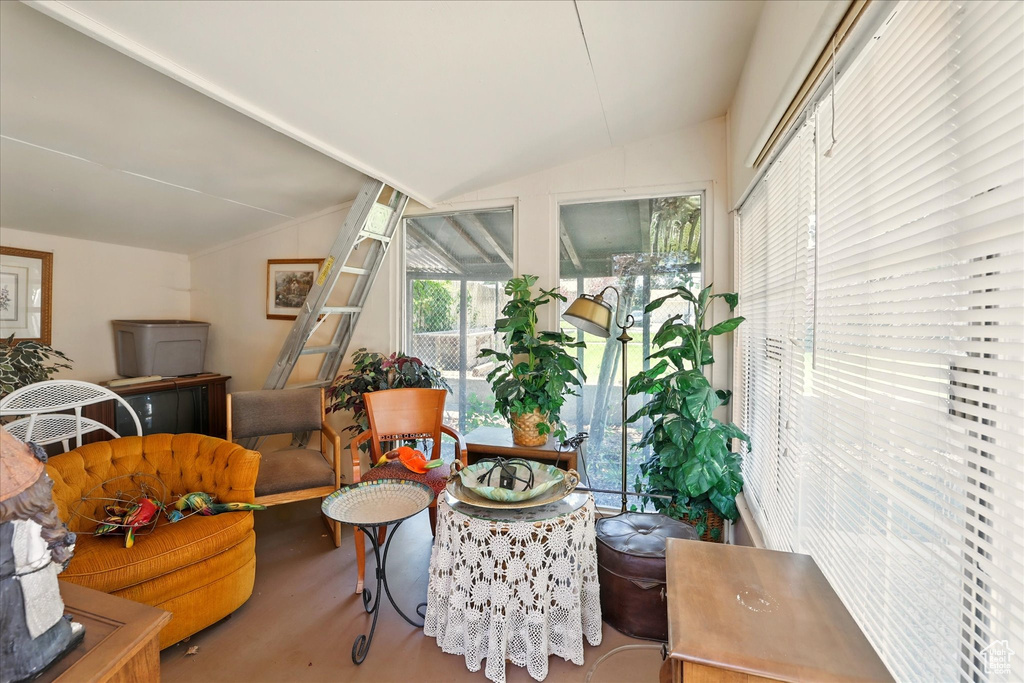 Living area featuring vaulted ceiling