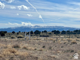 View of mountain backdrop featuring rural landscape