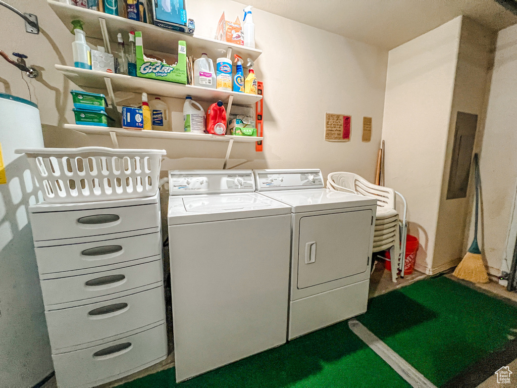 Laundry area featuring washing machine and clothes dryer and water heater