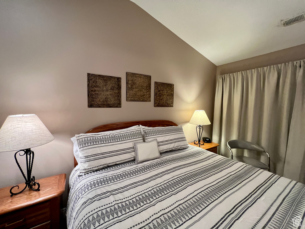 Bedroom with vaulted ceiling