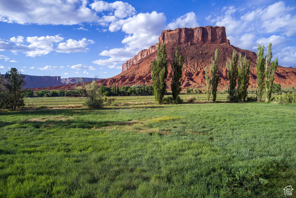 View of mountain backdrop featuring rural landscape