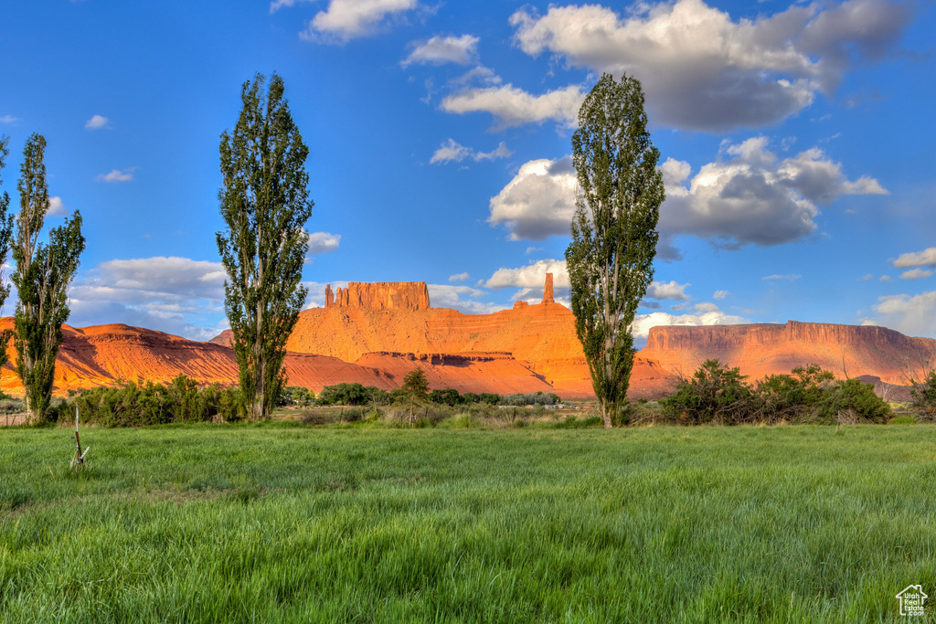 View of mountain backdrop with rural landscape