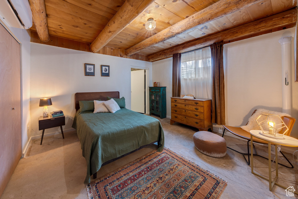 Bedroom with a wall mounted AC and wood ceiling with exposed beams