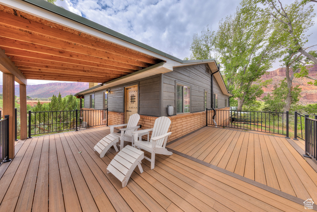 Wooden terrace featuring a mountain view