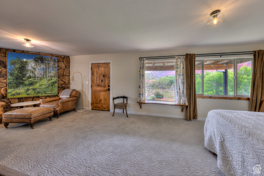 Carpeted bedroom with baseboards