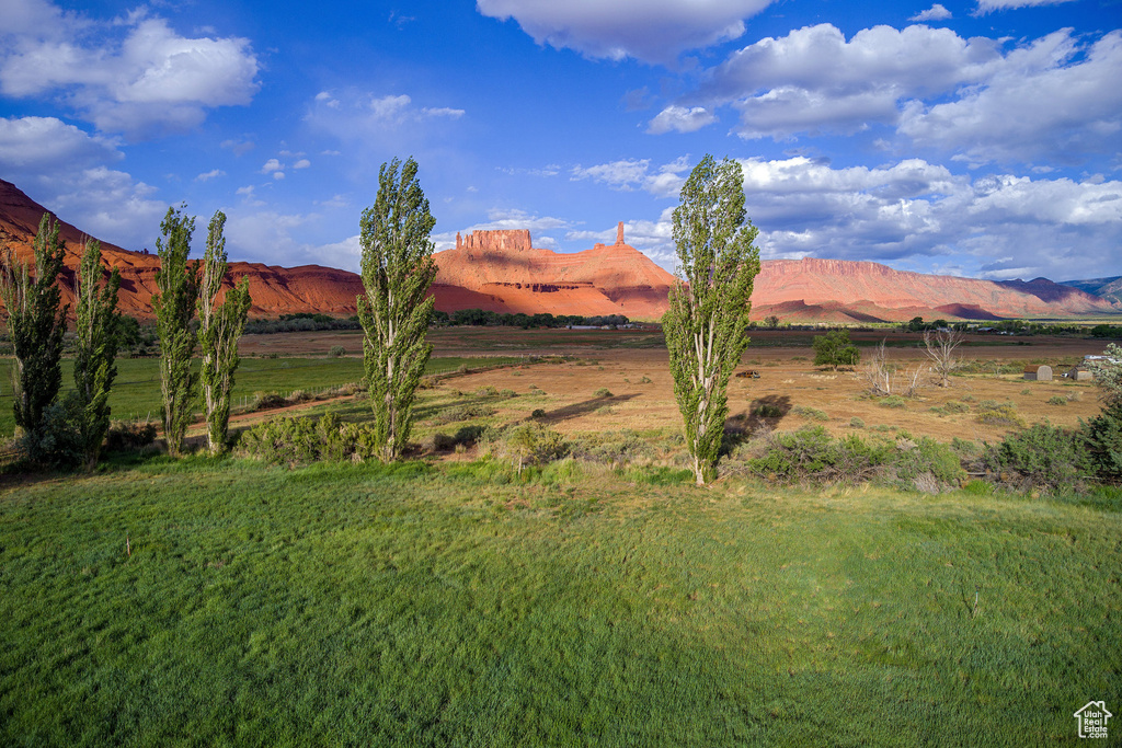 View of mountain backdrop featuring rural landscape