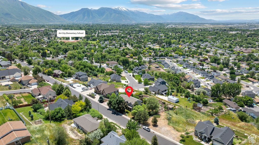 Aerial perspective of suburban area with a mountain backdrop