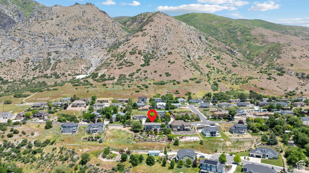 Aerial overview of property's location featuring a mountainous background