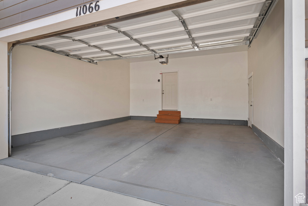 Garage featuring baseboards