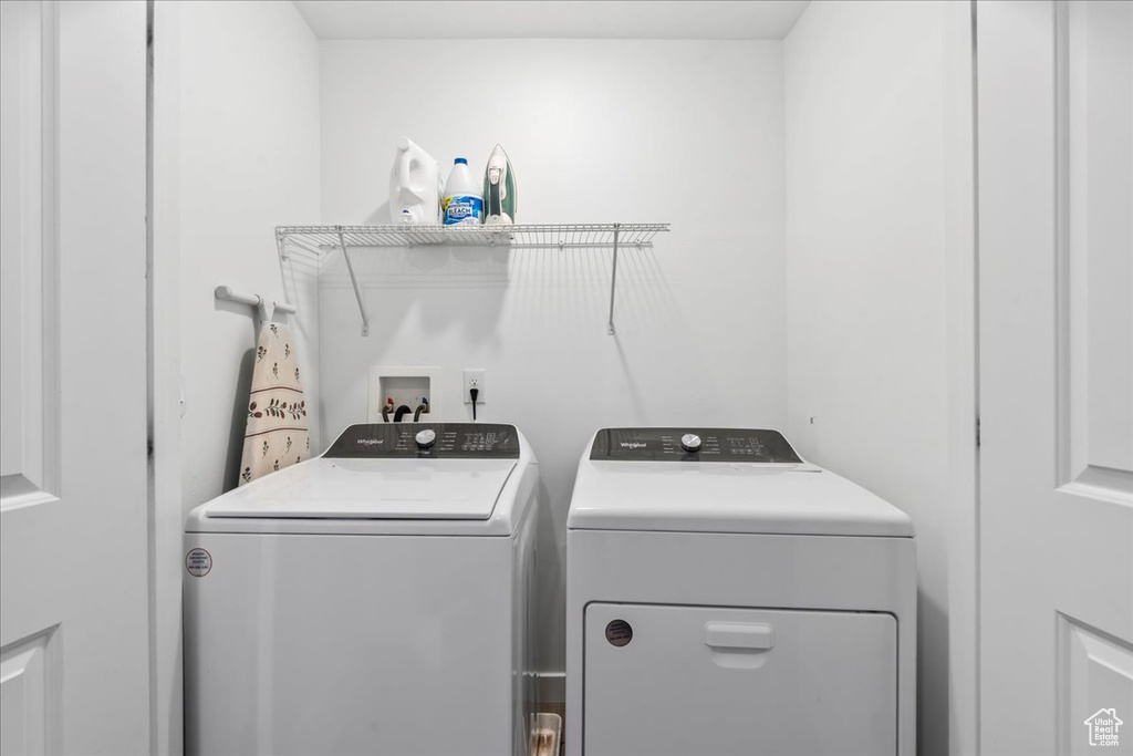 Laundry room with washing machine and dryer