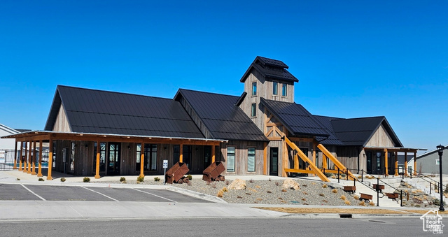 View of building exterior with uncovered parking