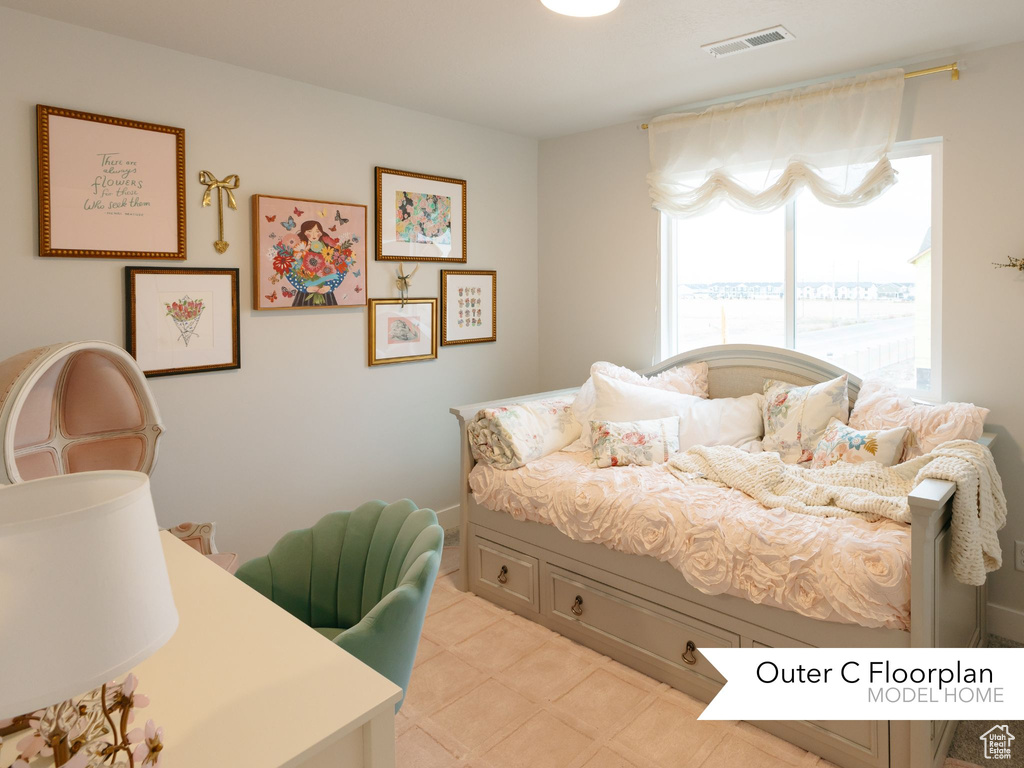 Bedroom featuring light floors