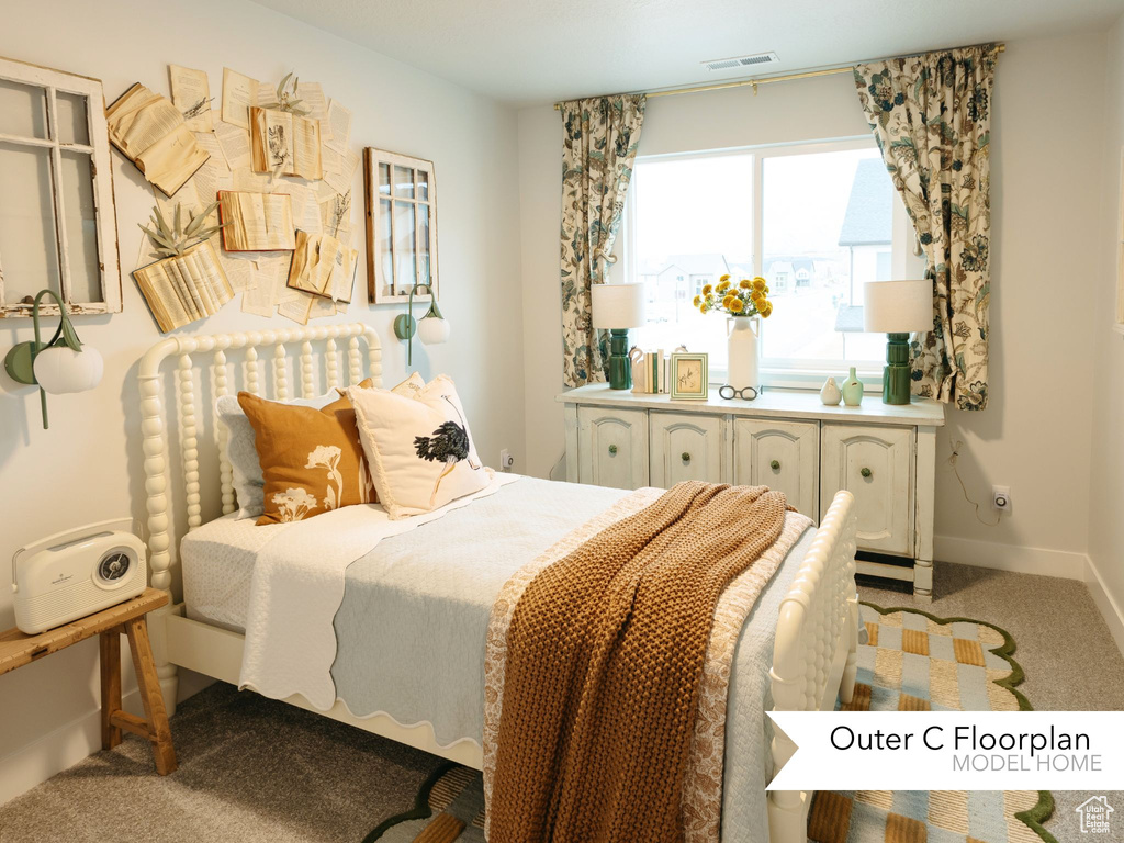 Carpeted bedroom featuring baseboards