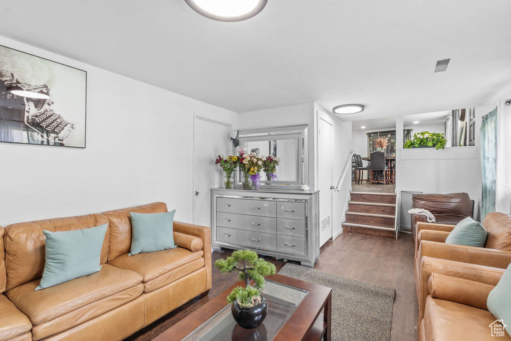 Living area with wood finished floors and stairs