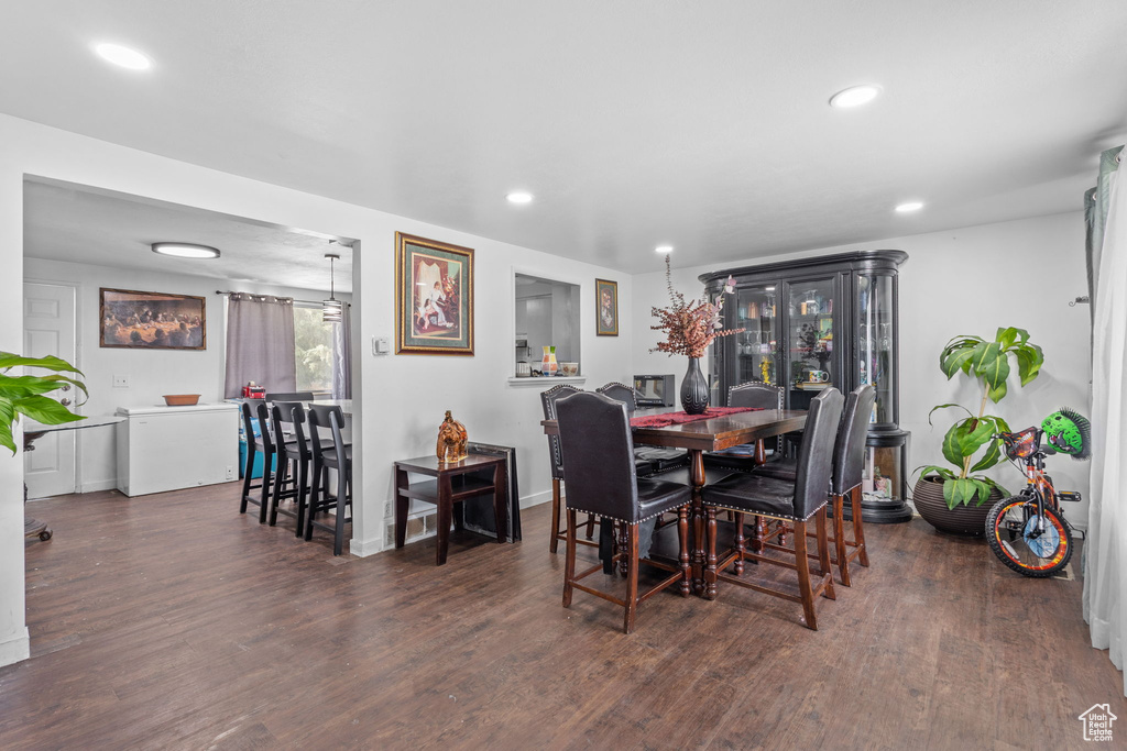 Dining space with wood finished floors, recessed lighting, and baseboards