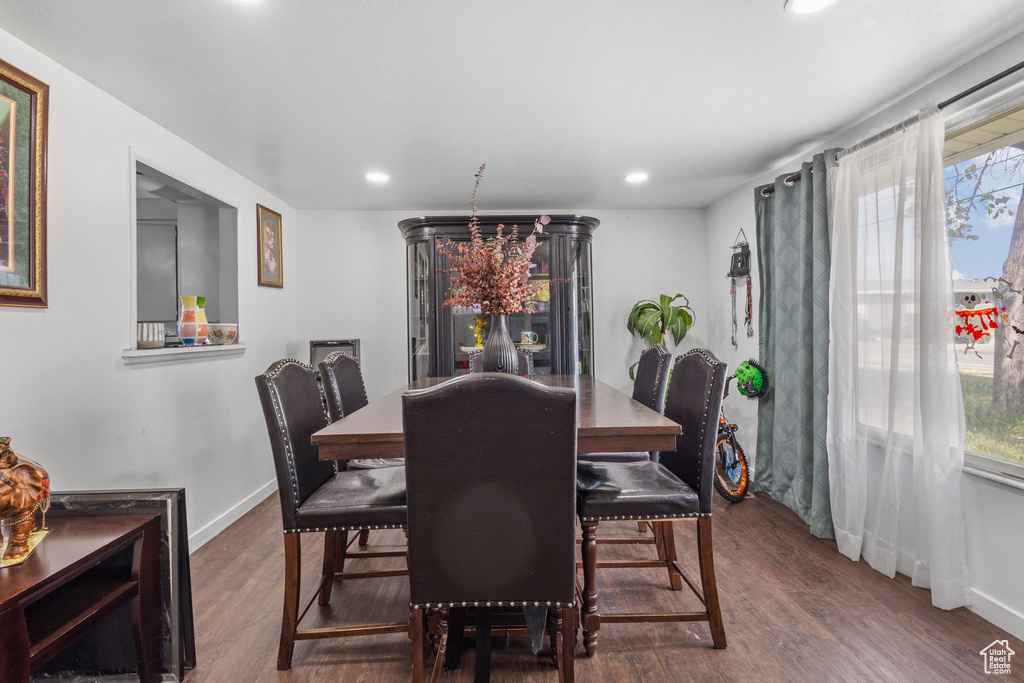 Dining room featuring wood finished floors, recessed lighting, plenty of natural light, and baseboards