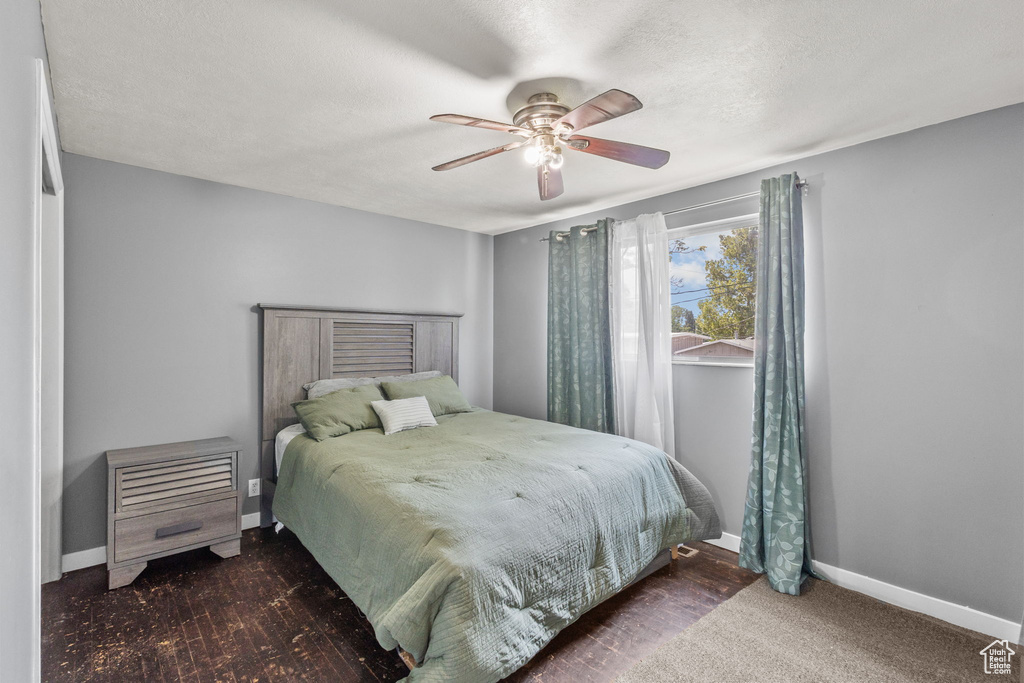 Bedroom with baseboards and a ceiling fan