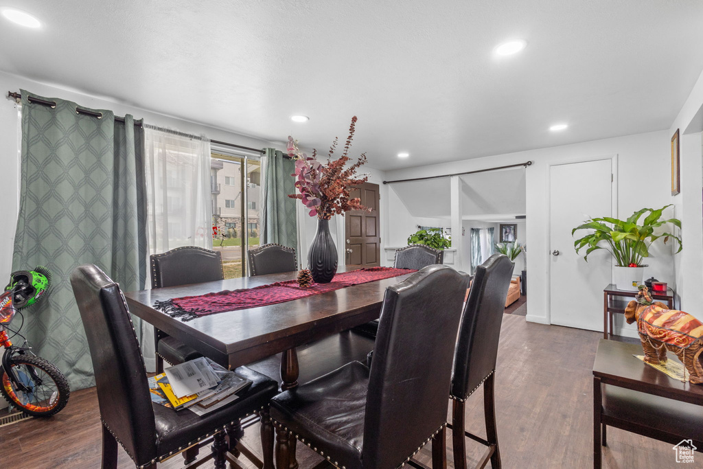 Dining space featuring wood finished floors, plenty of natural light, and recessed lighting