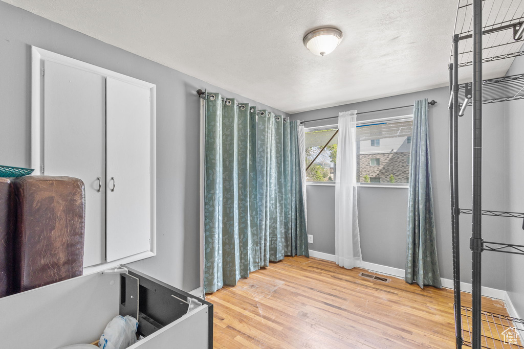 Bathroom featuring baseboards and wood finished floors